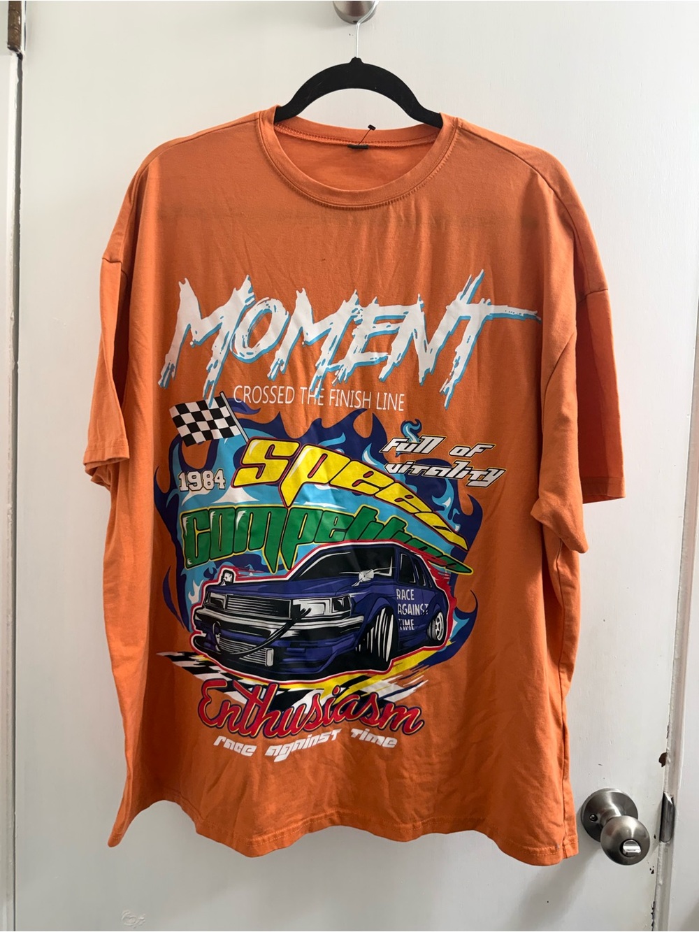 Shein orange graphic tee featuring a 1984 racing car design. Size large